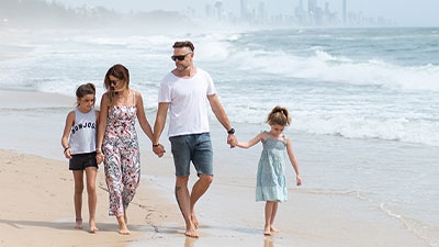 Family walking along the beach