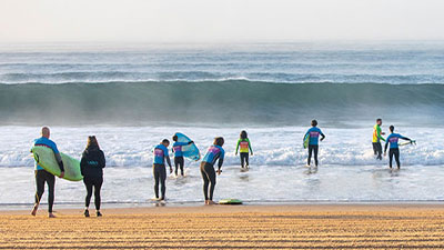 A group of people learning to surf