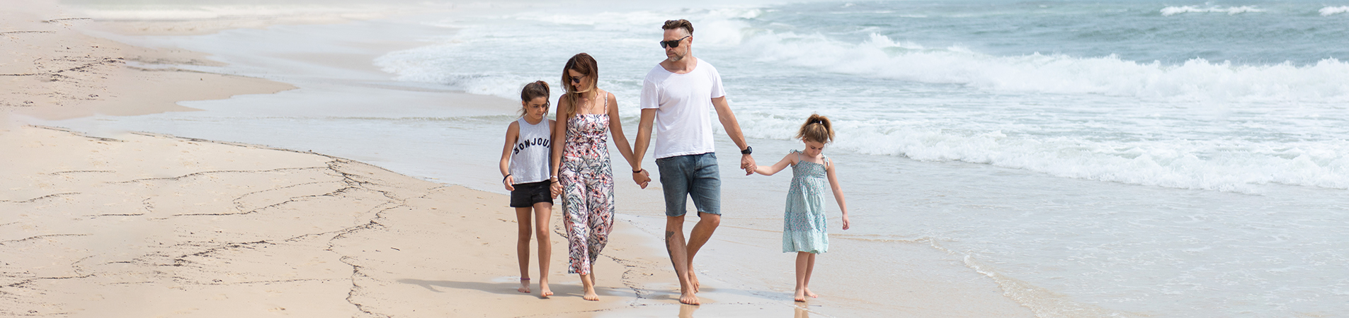 Family walking on the beach