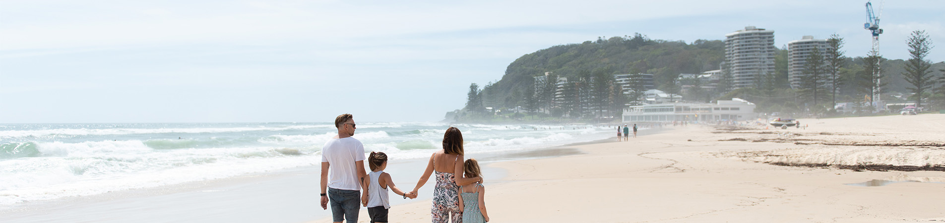 Veteran family walking on the beach for Reboot recovery event