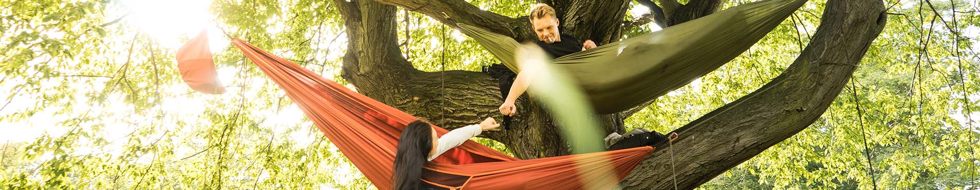 People relaxing in hammocks