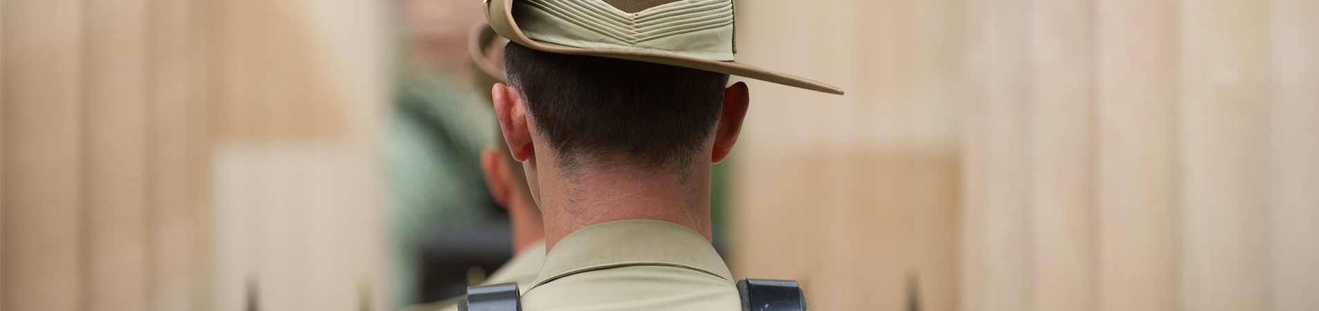 Image of a man in an army uniform at a Remembrance Day service