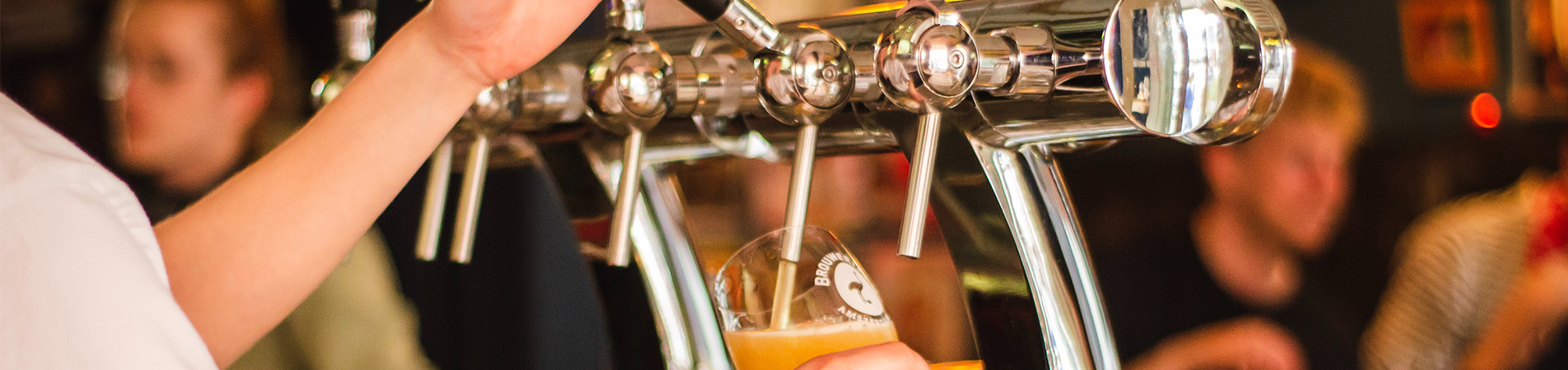 Pouring a beer social gathering