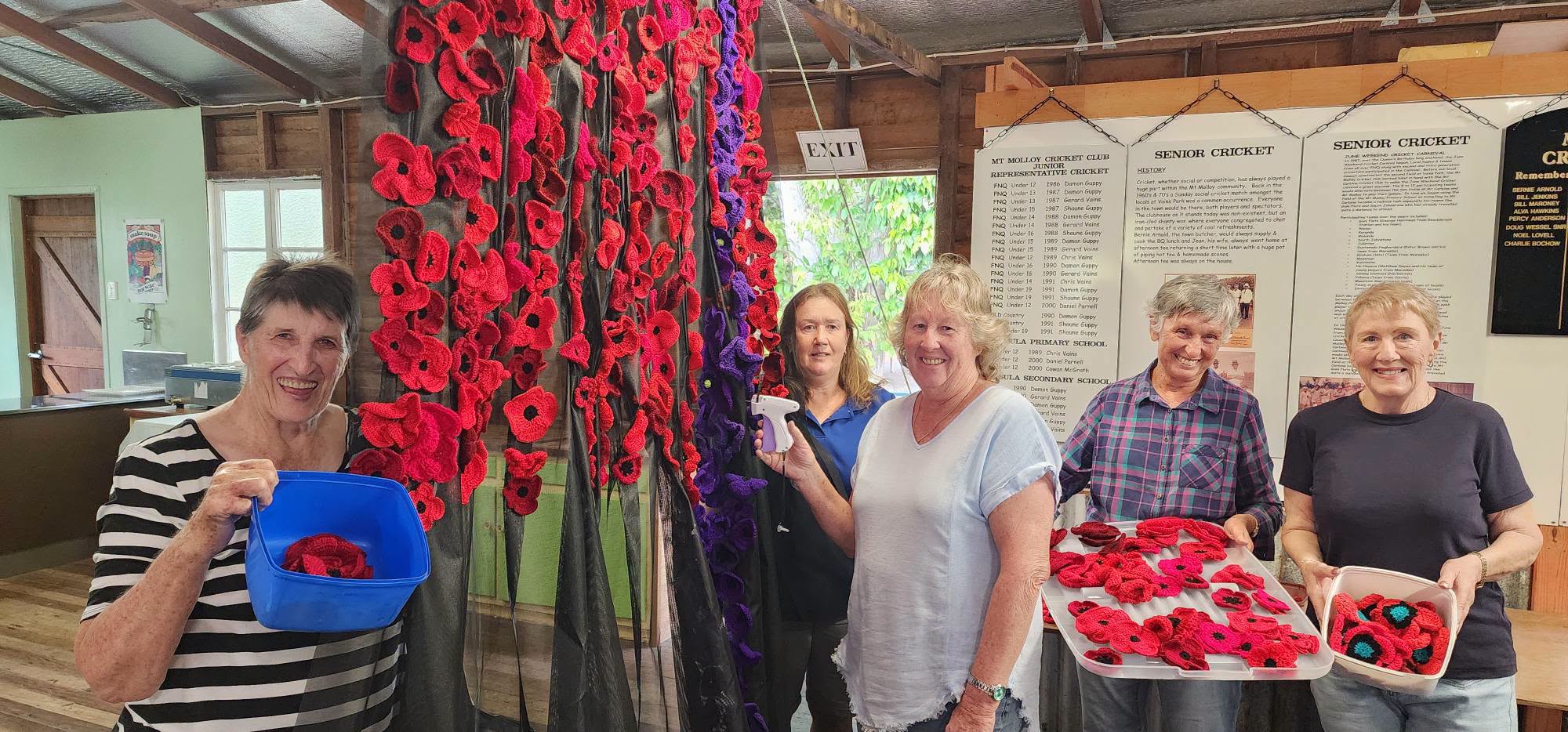 Helping to prepare the poppy waterfall are (from left to right) Mount Molloy RSL social 	member Daphne Craven, Sub Branch President Kerrie Pashen, community volunteer Tracey McDougall, community volunteer Jenny Clayton and Sub Branch social member Sue Tremellen.