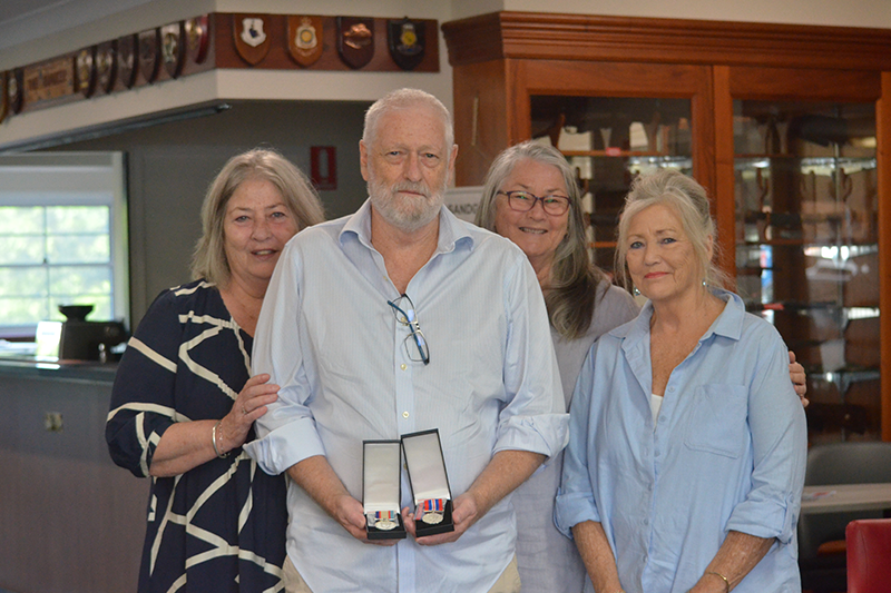 Sybil and Tom’s children with her posthumous medals in April 2026.