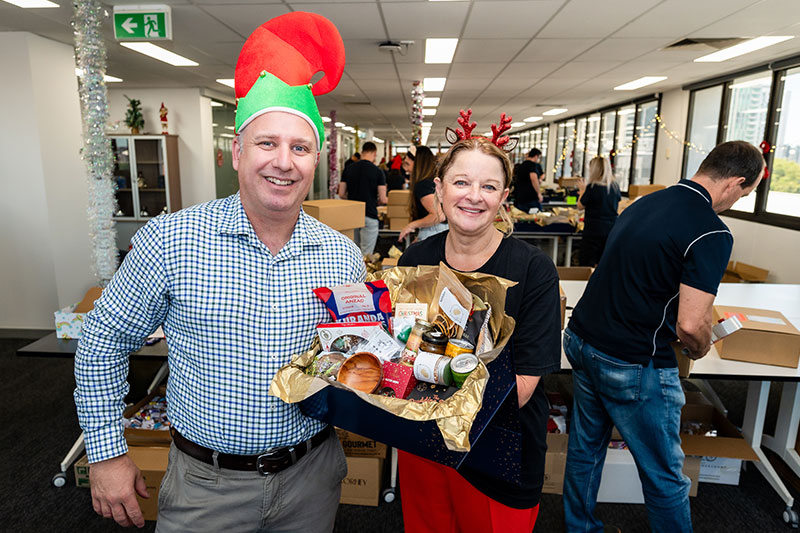 Rob Skoda and Leigh Goldsmith with Christmas Hampers for veterans