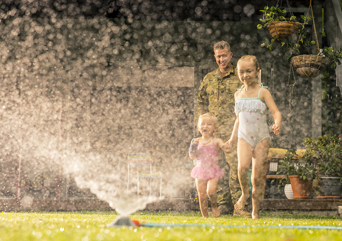 Kids in sprinkler