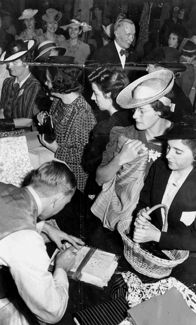 Women purchasing rationed goods in WWII