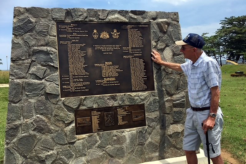 WWII veteran Len McLeod at war memorial