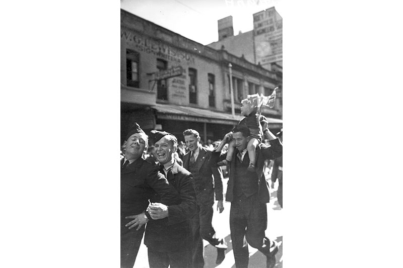 Soldiers enjoy participating the VJ Day procession, 1945