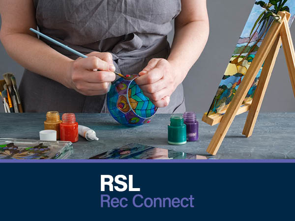 Person doing glass painting with the RSL Rec Connect Logo