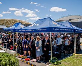 Male and female sit outside and socialise