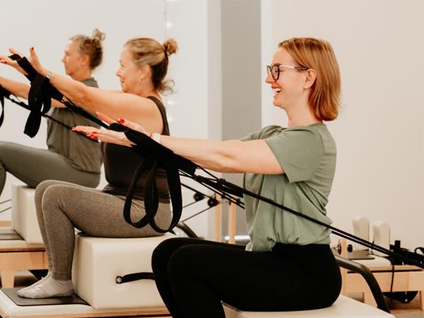 Women in reformer Pilates class