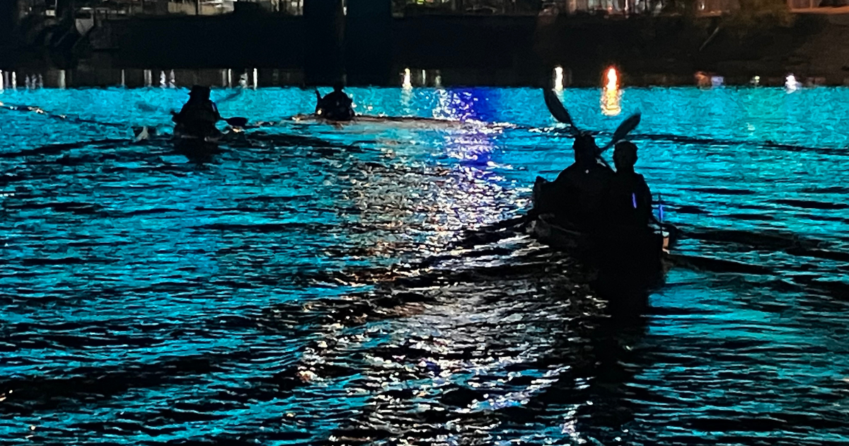 Recreation of Scorpion Raid Canoes on the water