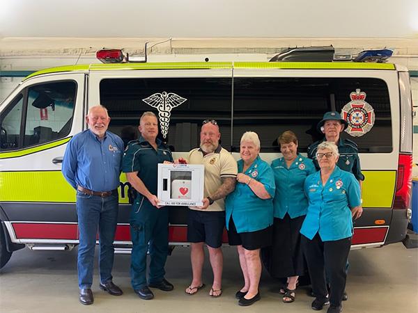 Jock Ruthven and peers in front of Ambulance