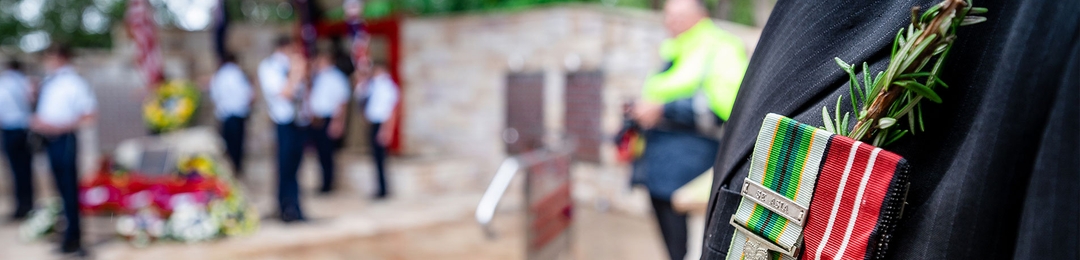 War medals with rosemary pinned to a suit jacket