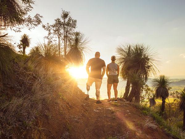 Two veterans hiking and watching the sunrise