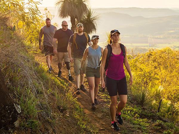 Veterans walking down a hiking trail