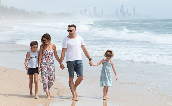 Family walking on the beach